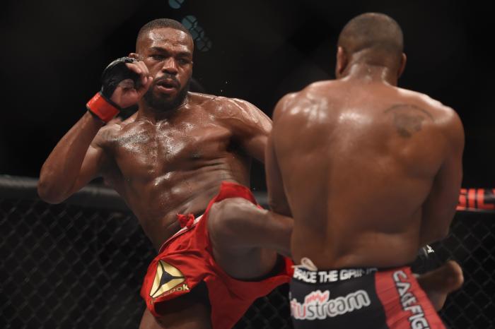 Jon Jones kicks Daniel Cormier in their UFC light heavyweight championship bout during the UFC 182 event at the MGM Grand Garden Arena on January 3, 2015 in Las Vegas, Nevada.