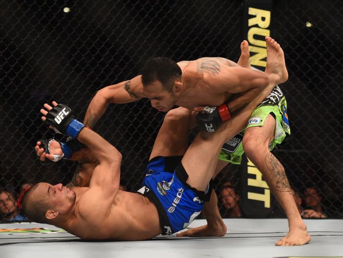 Tony Ferguson punches Gleison Tibau in their lightweight bout during the UFC 184 event at Staples Center on February 28, 2015 in Los Angeles, California.