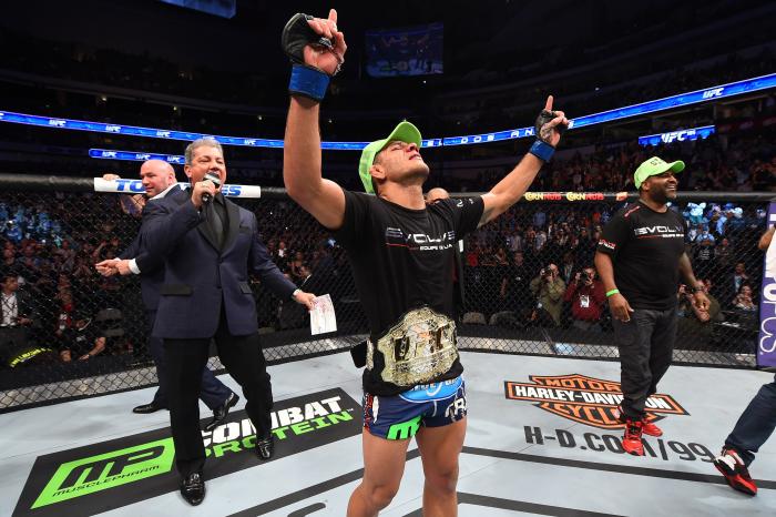 DALLAS, TX - MARCH 14: Rafael dos Anjos of Brazil celebrates after being announced the new UFC Lightweight Champion after defeating Anthony Pettis in their UFC lightweight championship bout during the UFC 185 event at the American Airlines Center on March 14, 2015 in Dallas, Texas. (Photo by Josh Hedges/Zuffa LLC/Zuffa LLC via Getty Images)