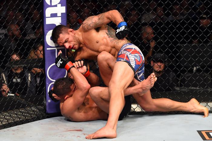 DALLAS, TX - MARCH 14: (R-L) Rafael dos Anjos of Brazil controls the body of Anthony Pettis in their UFC lightweight championship bout during the UFC 185 event at the American Airlines Center on March 14, 2015 in Dallas, Texas. (Photo by Josh Hedges/Zuffa LLC/Zuffa LLC via Getty Images)