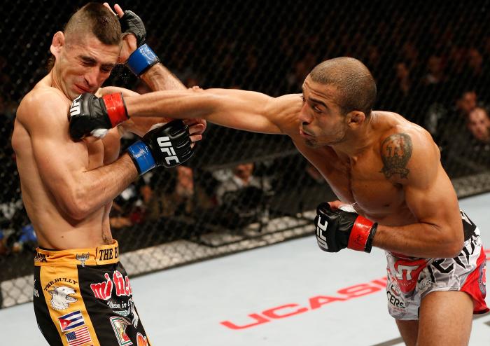 NEWARK, NJ - FEBRUARY 01: (R-L) Jose Aldo punches Ricardo Lamas in their featherweight championship fight at the UFC 169 event inside the Prudential Center on February 1, 2014 in Newark, New Jersey. (Photo by Josh Hedges/Zuffa LLC via Getty Images)
