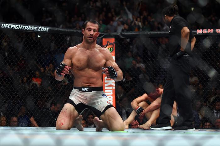 LAS VEGAS, NEVADA - DECEMBER 12: (L-R) Luke Rockhold celebrates after defeating Chris Weidman in their middleweight championship bout during the UFC 194 event inside MGM Grand Garden Arena on December 12, 2015 in Las Vegas, Nevada. (Photo by Jeff Bottari/Zuffa LLC/Zuffa LLC via Getty Images)