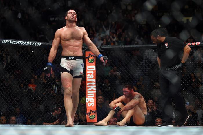 LAS VEGAS, NEVADA - DECEMBER 12: (L-R) Luke Rockhold celebrates after defeating Chris Weidman in their middleweight championship bout during the UFC 194 event inside MGM Grand Garden Arena on December 12, 2015 in Las Vegas, Nevada. (Photo by Jeff Bottari/Zuffa LLC/Zuffa LLC via Getty Images)