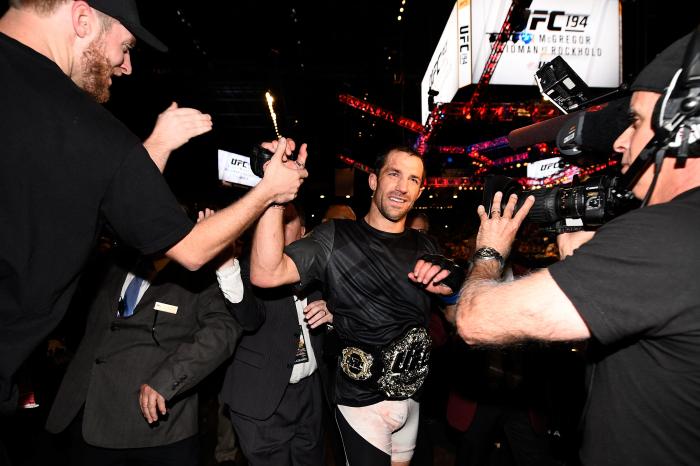 LAS VEGAS, NEVADA - DECEMBER 12: UFC middleweight champion Luke Rockhold celebrates withs fans after defeating Chris Weidman in their middleweight championship bout during the UFC 194 event inside MGM Grand Garden Arena on December 12, 2015 in Las Vegas, Nevada. (Photo by Jeff Bottari/Zuffa LLC/Zuffa LLC via Getty Images)