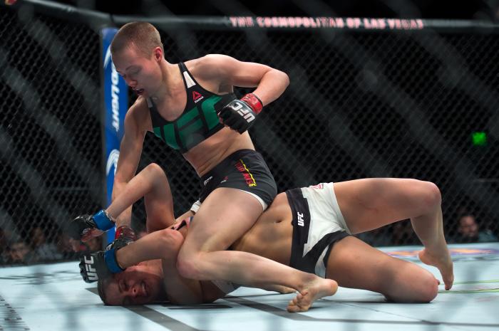 LAS VEGAS, NEVADA - DECEMBER 10: (Top) Rose Namajunas punches Paige VanZant in their women's strawweight bout during the UFC Fight Night event at The Chelsea at the Cosmopolitan of Las Vegas on December 10, 2015 in Las Vegas, Nevada. (Photo by Brandon Magnus/Zuffa LLC via Getty Images)
