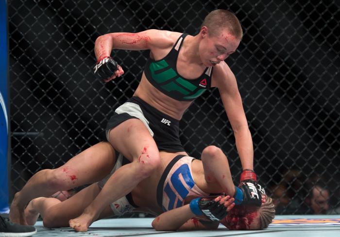 LAS VEGAS, NEVADA - DECEMBER 10: (Top) Rose Namajunas punches Paige VanZant in their women's strawweight bout during the UFC Fight Night event at The Chelsea at the Cosmopolitan of Las Vegas on December 10, 2015 in Las Vegas, Nevada. (Photo by Brandon Magnus/Zuffa LLC via Getty Images)