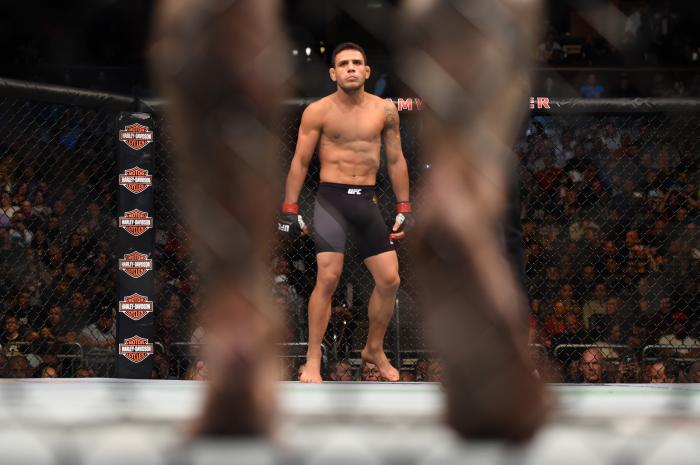 ORLANDO, FL - DECEMBER 19: Rafael dos Anjos looks across the Octagon at Donald Cerrone before their UFC lightweight title bout during the UFC Fight Night event at the Amway Center on December 19, 2015 in Orlando, Florida. (Photo by Jeff Bottari/Zuffa LLC/Zuffa LLC via Getty Images)