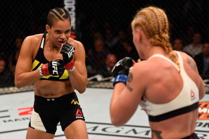 Amanda Nunes stands in front of Valentina Shevchenko in their women's bantamweight bout during the UFC 196 event inside MGM Grand Garden Arena on March 5, 2016 in Las Vegas, Nevada.