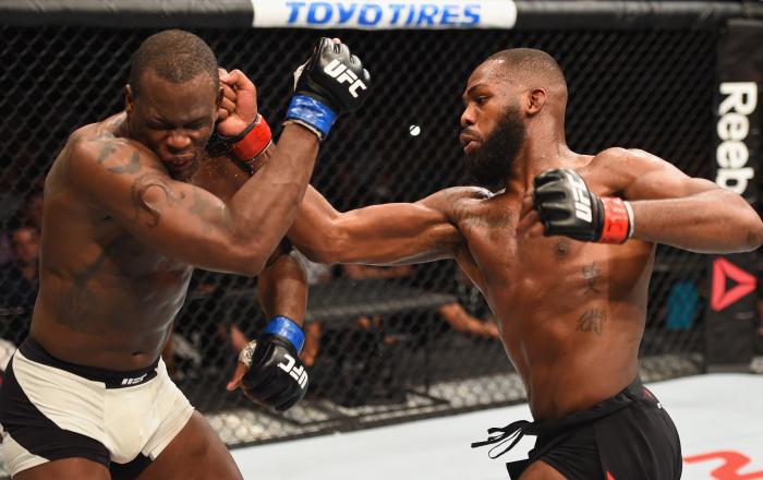 Jon Jones punches Ovince Saint Preux in their interim UFC light heavyweight championship bout during the UFC 197 event inside MGM Grand Garden Arena on April 23, 2016 in Las Vegas, Nevada.