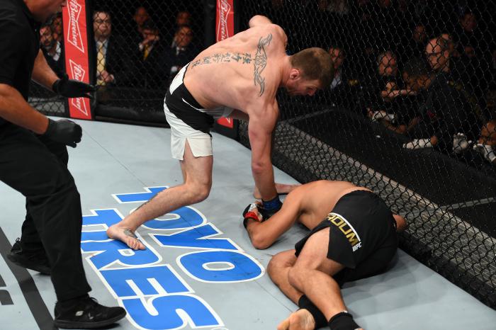 CURITIBA, BRAZIL - MAY 14: (L-R) Stipe Miocic punches Fabricio Werdum of Brazil in their UFC heavyweight championship bout during the UFC 198 event at Arena da Baixada stadium on May 14, 2016 in Curitiba, Parana, Brazil. (Photo by Josh Hedges/Zuffa LLC/Zuffa LLC via Getty Images)