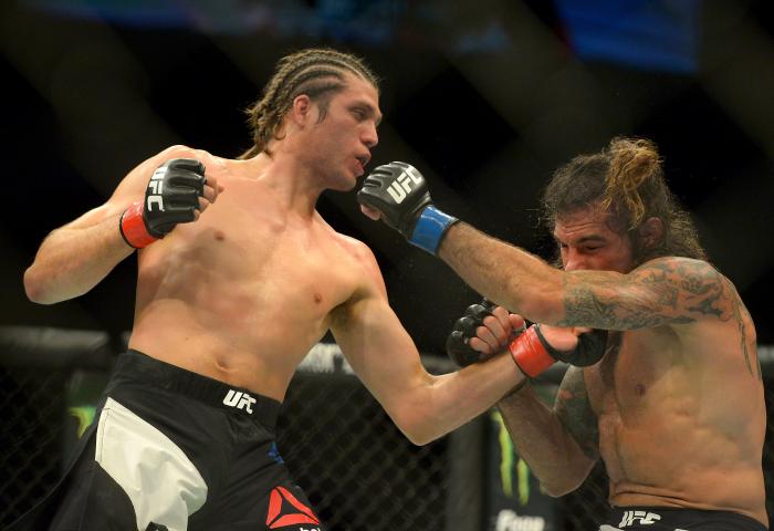 Brian Ortega punches Clay Guida at The Forum on June 4, 2016 in Inglewood, California.