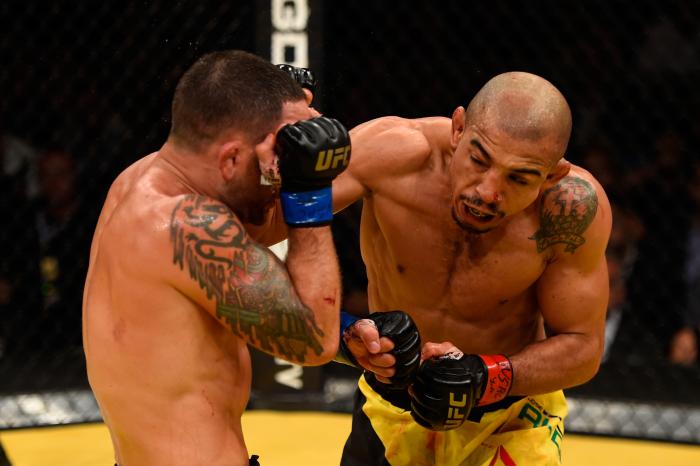 Jose Aldo punches Frankie Edgar in their UFC interim featherweight championship bout during the UFC 200 event on July 9, 2016 at T-Mobile Arena in Las Vegas, Nevada.