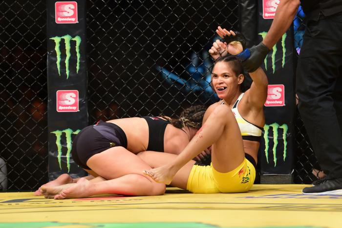Amanda Nunes celebrates her victory over Miesha Tate in their UFC women's bantamweight championship bout during the UFC 200 event on July 9, 2016 at T-Mobile Arena in Las Vegas, Nevada.
