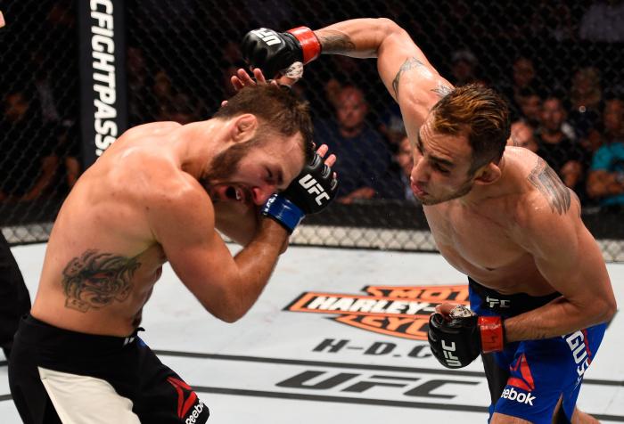 SIOUX FALLS, SD - JULY 13: (R-L) Tony Ferguson punches Lando Vannat in their lightweight bout during the UFC Fight Night event on July 13, 2016 at Denny Sanford Premier Center in Sioux Falls, South Dakota. (Photo by Jeff Bottari/Zuffa LLC via Getty Images)