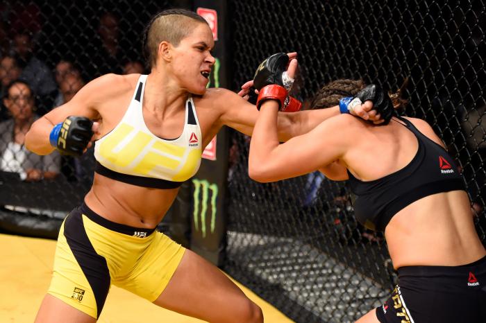 LAS VEGAS, NV - JULY 09: (L-R) Amanda Nunes of Brazil punches Miesha Tate in their UFC women's bantamweight championship bout during the UFC 200 event at T-Mobile Arena on July 9, 2016 in Las Vegas, Nevada. (Photo by Josh Hedges/Zuffa LLC/Zuffa LLC via Getty Images)