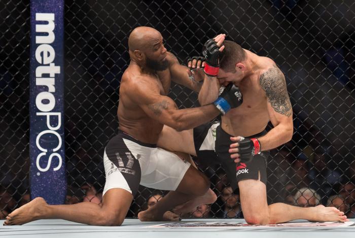 NEW YORK, NY - NOVEMBER 12: (L-R) Yoel Romero of Cuba punches Chris Weidman in their middleweight fight during the UFC 205 event at Madison Square Garden on November 12, 2016 in New York City. (Photo by Brandon Magnus/Zuffa LLC via Getty Images)