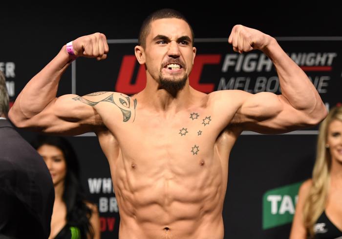 MELBOURNE, AUSTRALIA - NOVEMBER 26: Robert Whittaker of New Zealand poses on the scale during the UFC weigh-in at Rod Laver Arena on November 26, 2016 in Melbourne, Australia. (Photo by Jeff Bottari/Zuffa LLC via Getty Images)