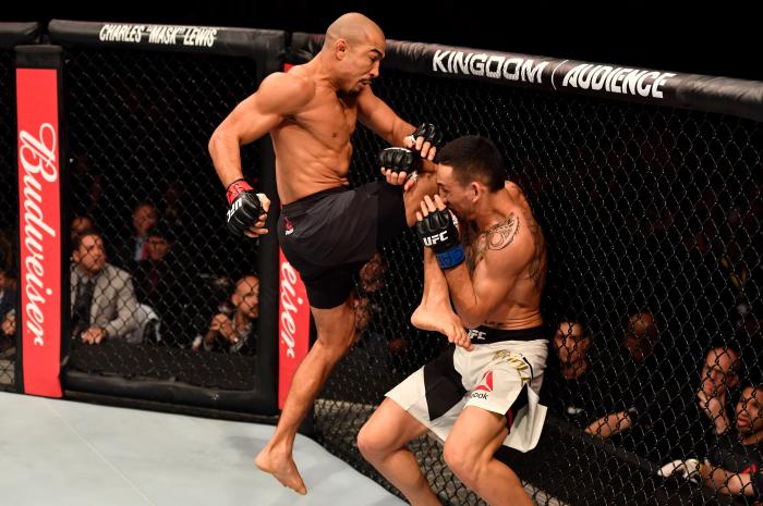 RIO DE JANEIRO, BRAZIL - JUNE 03: (L-R) Jose Aldo of Brazil lands a flying knee against Max Holloway in their UFC featherweight championship bout during the UFC 212 event at Jeunesse Arena on June 3, 2017 in Rio de Janeiro, Brazil. (Photo by Jeff Bottari/Zuffa LLC via Getty Images)