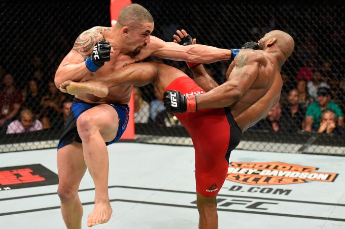 Robert Whittaker throws a punch at Yoel Romero in their interim UFC middleweight championship bout during the UFC 213 event at T-Mobile Arena on July 8, 2017 in Las Vegas, Nevada.
