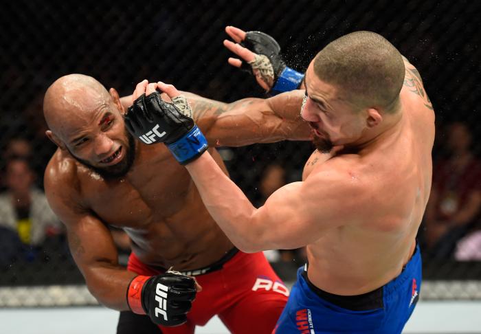 Yoel Romero punches Robert Whittaker in their interim UFC middleweight championship bout during the UFC 213 event at T-Mobile Arena on July 8, 2017 in Las Vegas, Nevada.