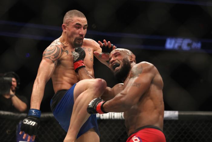 Robert Whittaker throws a knee at Yoel Romero in their interim UFC middleweight championship bout during the UFC 213 event at T-Mobile Arena on July 8, 2017 in Las Vegas, Nevada.