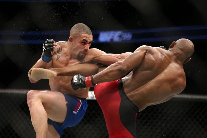LAS VEGAS, NV - JULY 9: (L-R) Robert Whittaker punches Yoel Romero in their interim UFC middleweight championship bout during the UFC 213 event at T-Mobile Arena on July 9, 2017 in Las Vegas, Nevada. (Photo by Rey Del Rio/Getty Images)
