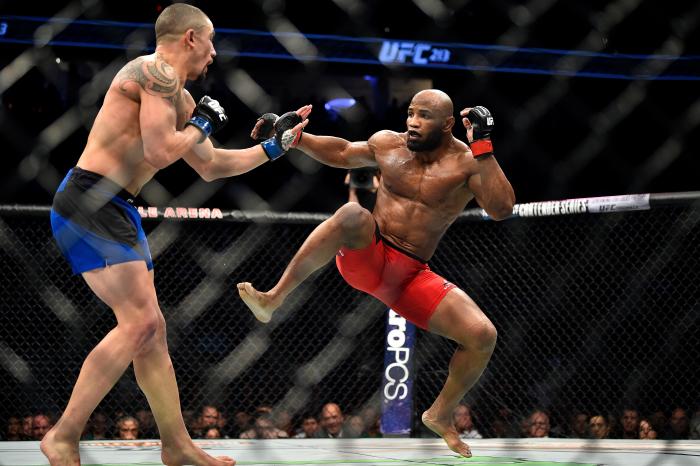 LAS VEGAS, NV - JULY 08: (R-L) Yoel Romero of Cuba attempts to leg check Robert Whittaker of New Zealand in their interim UFC middleweight championship bout during the UFC 213 event at the T-Mobile Arena on July 8, 2017 in Las Vegas, Nevada. (Photo by Jeff Bottari/Zuffa LLC via Getty Images)