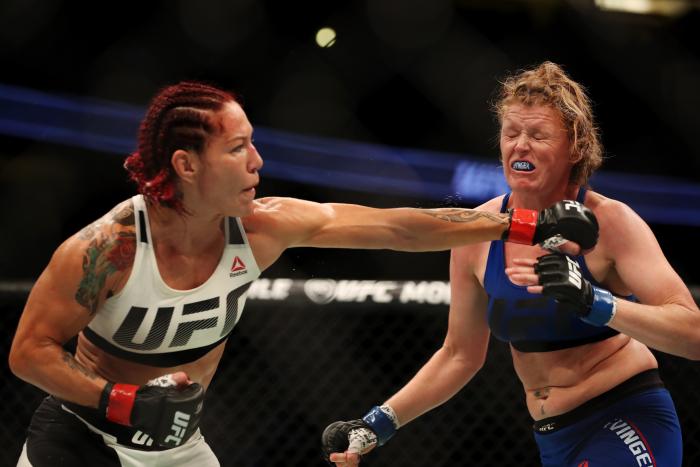 Cris Cyborg punches Tonya Evinger in their UFC women's featherweight championship bout during the UFC 214 event at Honda Center on July 29, 2017 in Anaheim, California.