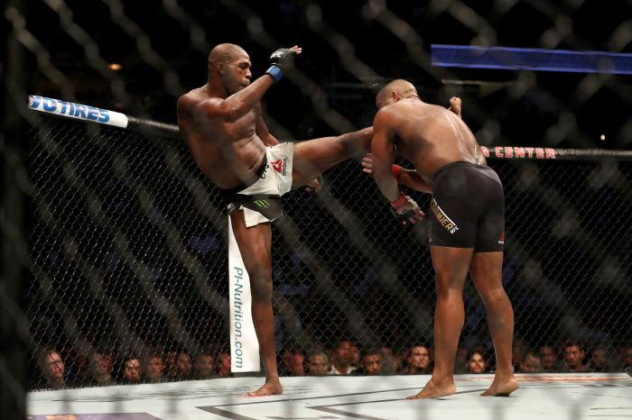 Jon jones kicks Daniel Cormier in their UFC light heavyweight championship bout during the UFC 214 event at Honda Center on July 29, 2017 in Anaheim, California.