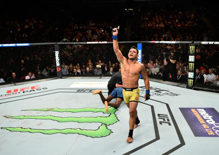 EDMONTON, AB - SEPTEMBER 09: (R-L) Rafael Dos Anjos of Brazil celebrates his submission victory over Neil Magny in their welterweight bout during the UFC 215 event inside the Rogers Place on September 9, 2017 in Edmonton, Alberta, Canada. (Photo by Jeff Bottari/Zuffa LLC/Zuffa LLC via Getty Images)
