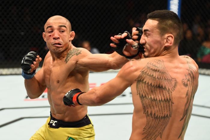 DETROIT, MI - DECEMBER 02: (L-R) Jose Aldo of Brazil punches Max Holloway in their UFC featherweight championship bout during the UFC 218 event inside Little Caesars Arena on December 02, 2017 in Detroit, Michigan. (Photo by Josh Hedges/Zuffa LLC via Getty Images)