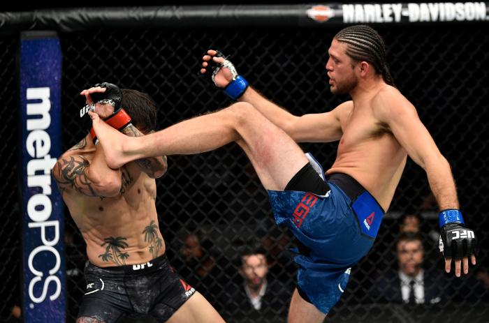 FRESNO, CA - DECEMBER 09: (R-L) Brian Ortega kicks Cub Swanson in their featherweight bout during the UFC Fight Night event inside Save Mart Center on December 9, 2017 in Fresno, California. (Photo by Jeff Bottari/Zuffa LLC via Getty Images)
