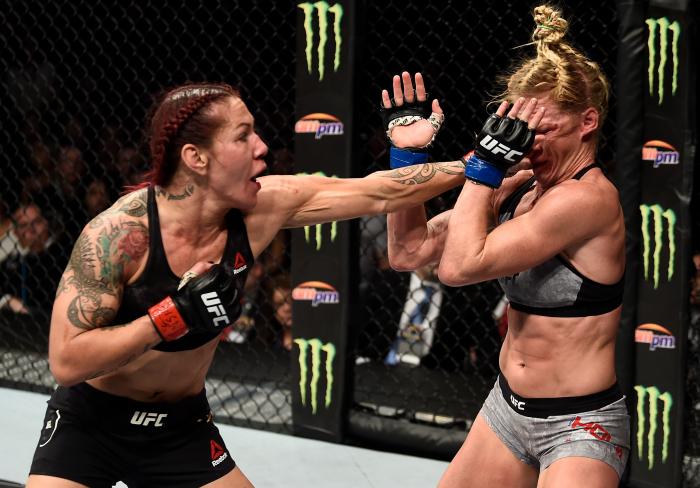 LAS VEGAS, NV - DECEMBER 30: (L-R) Cris Cyborg of Brazil punches Holly Holm in their women's featherweight bout during the UFC 219 event inside T-Mobile Arena on December 30, 2017 in Las Vegas, Nevada. (Photo by Jeff Bottari/Zuffa LLC via Getty Images)