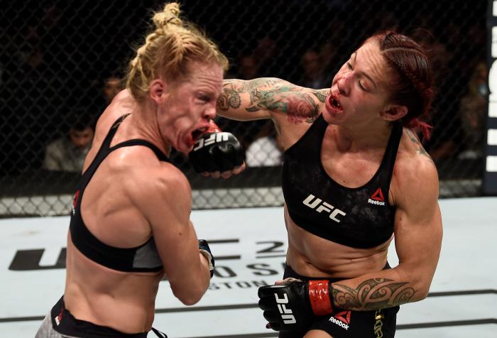 LAS VEGAS, NV - DECEMBER 30: (R-L) Cris Cyborg of Brazil punches Holly Holm in their women's featherweight bout during the UFC 219 event inside T-Mobile Arena on December 30, 2017 in Las Vegas, Nevada. (Photo by Jeff Bottari/Zuffa LLC via Getty Images)