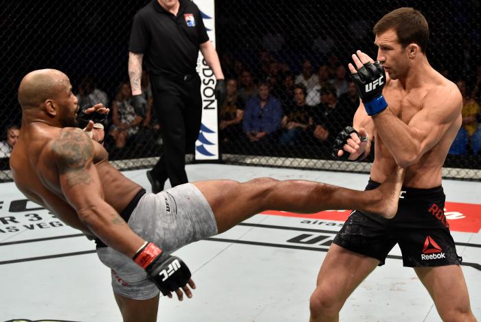 PERTH, AUSTRALIA - FEBRUARY 11: (L-R) Yoel Romero of Cuba kicks Luke Rockhold in their interim middleweight title bout during the UFC 221 event at Perth Arena on February 11, 2018 in Perth, Australia. (Photo by Jeff Bottari/Zuffa LLC via Getty Images)