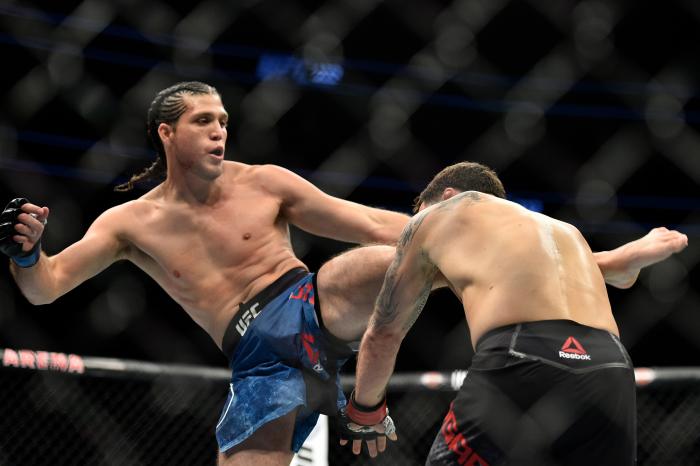 LAS VEGAS, NV - MARCH 03: (L-R) Brian Ortega kicks Frankie Edgar in their featherweight bout during the UFC 222 event inside T-Mobile Arena on March 3, 2018 in Las Vegas, Nevada. (Photo by Brandon Magnus/Zuffa LLC via Getty Images)