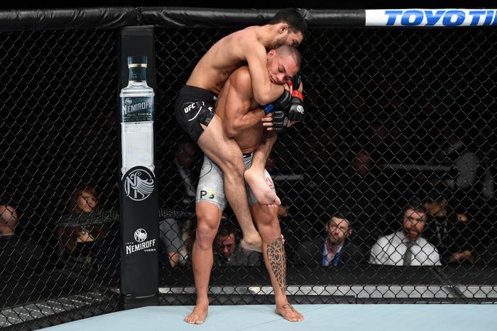 NEW YORK, NY - NOVEMBER 03: (L-R) Julio Arce attempts to submit Sheymon Moraes of Brazil in their featherweight bout during the UFC 230 event inside Madison Square Garden on November 3, 2018 in New York, New York. (Photo by Jeff Bottari/Zuffa LLC via Getty Images)