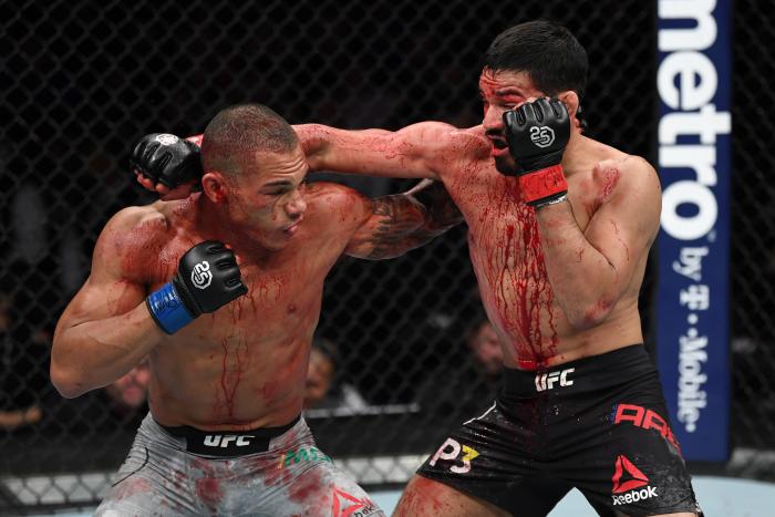 NEW YORK, NY - NOVEMBER 03: (R-L) Julio Arce punches Sheymon Moraes of Brazil in their featherweight bout during the UFC 230 event inside Madison Square Garden on November 3, 2018 in New York, New York. (Photo by Jeff Bottari/Zuffa LLC via Getty Images)