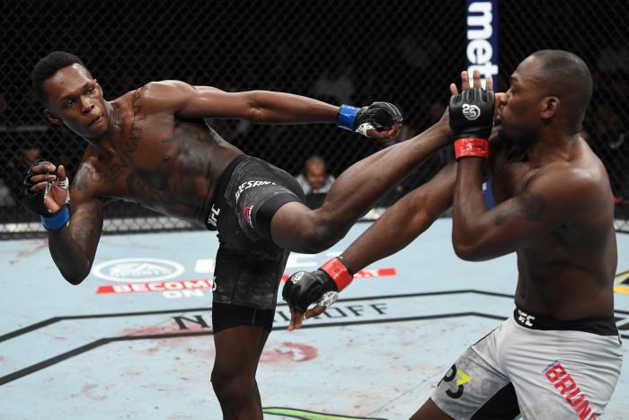 NEW YORK, NY - NOVEMBER 03: (L-R) Israel Adesanya of Nigeria kicks Derek Brunson in their middleweight bout during the UFC 230 event inside Madison Square Garden on November 3, 2018 in New York, New York. (Photo by Jeff Bottari/Zuffa LLC via Getty Images)