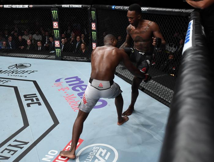 NEW YORK, NY - NOVEMBER 03: (R-L) Israel Adesanya of Nigeria knees Derek Brunson in their middleweight bout during the UFC 230 event inside Madison Square Garden on November 3, 2018 in New York, New York. (Photo by Jeff Bottari/Zuffa LLC via Getty Images)
