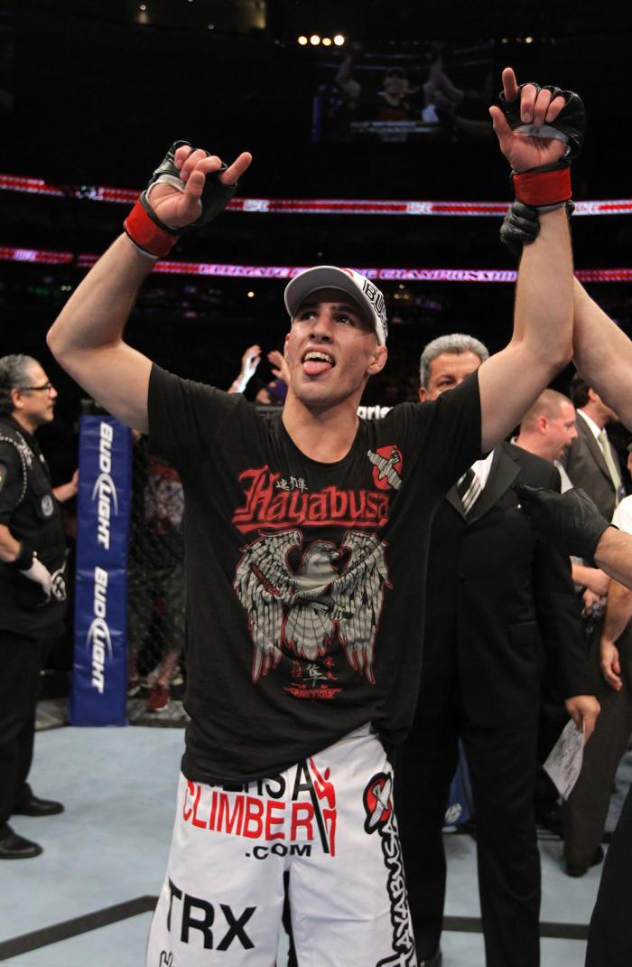 UFC 133: Rory MacDonald celebrates his win.