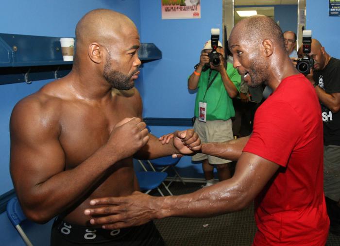 (R-L) World Champion boxer Bernard Hopkins gives Rashad Evans some boxing tips in the locker room at the Joe Hand Gym