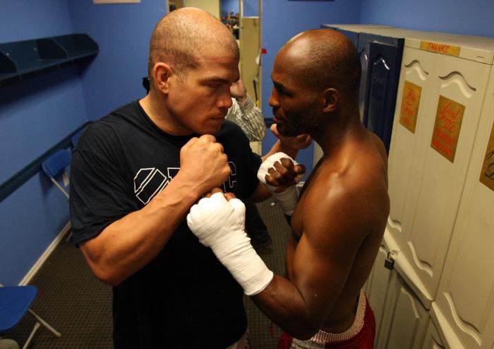 (R-L) World Champion boxer Bernard Hopkins and former UFC champion Tito Ortiz pose for a photo in the locker room at the Joe Hand Gym