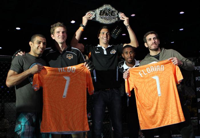 (L-R) UFC Featherweight Champion Jose Aldo, Houston Dynamo defender Bobby Boswell, Houston Dynamo midfielder Geoff Cameron, Houston Dynamo defender Corey Ashe, and UFC Featherweight title challenger Kenny Florian