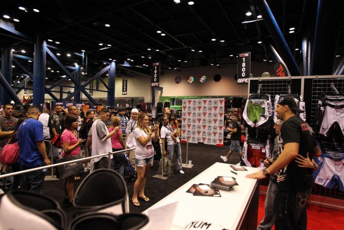 Fans line up to take pictures and get autographs from UFC fighter Brendan Schaub