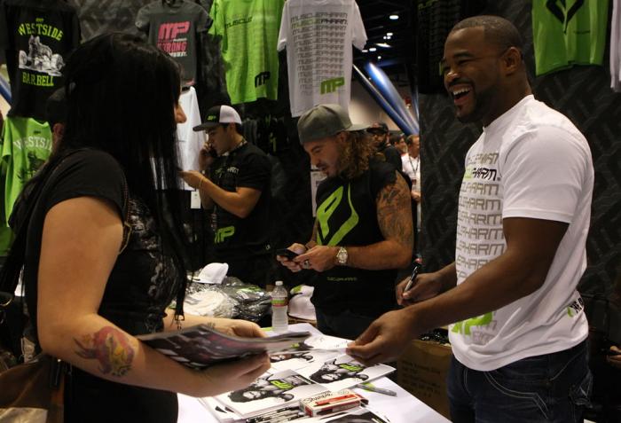 UFC Fighters Clay Guida and Rashad Evans signs autographs for fans