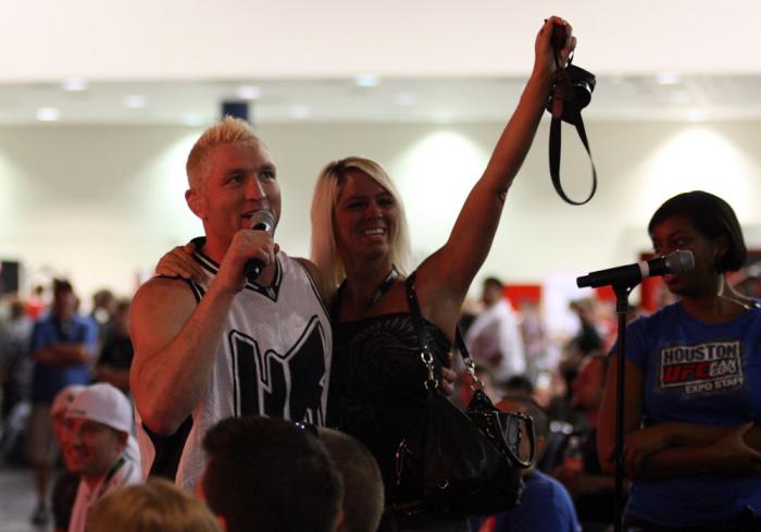Jason "Mayhem" Miller poses with a fan during the Q&A