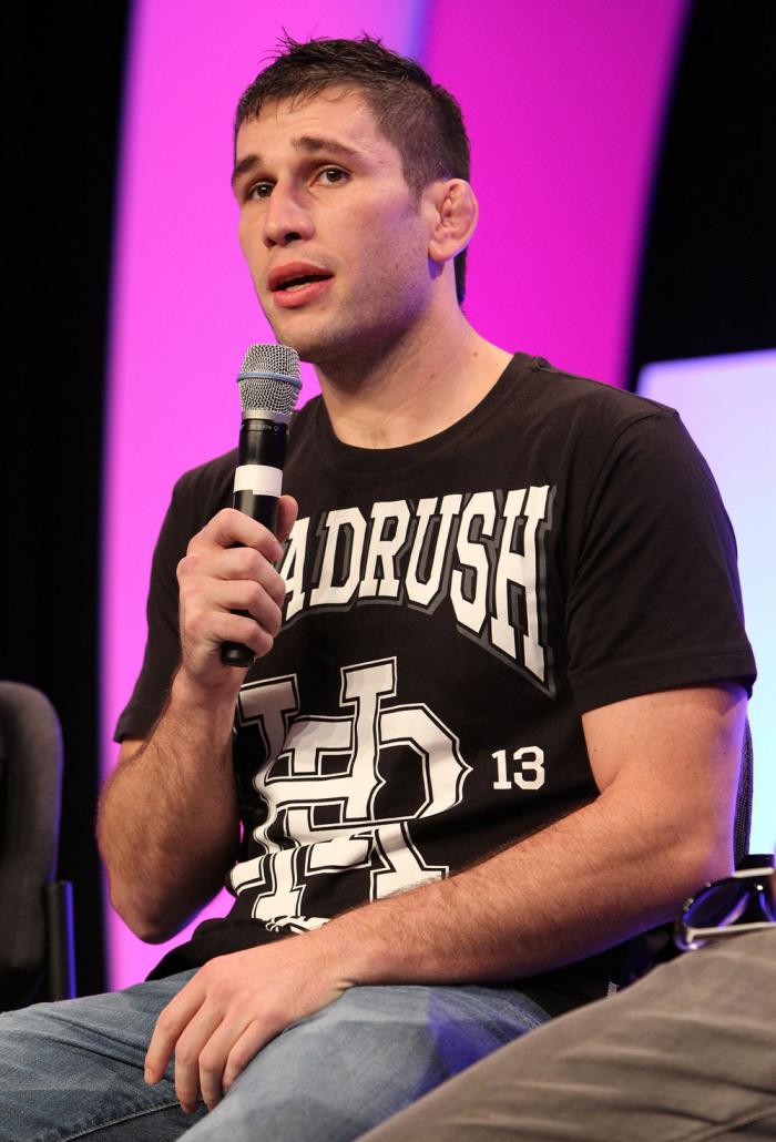 UFC fighter Amir Sadollah attends a Q&A session with former cast members of The Ultimate Fighter on the main stage at the UFC Fan Expo