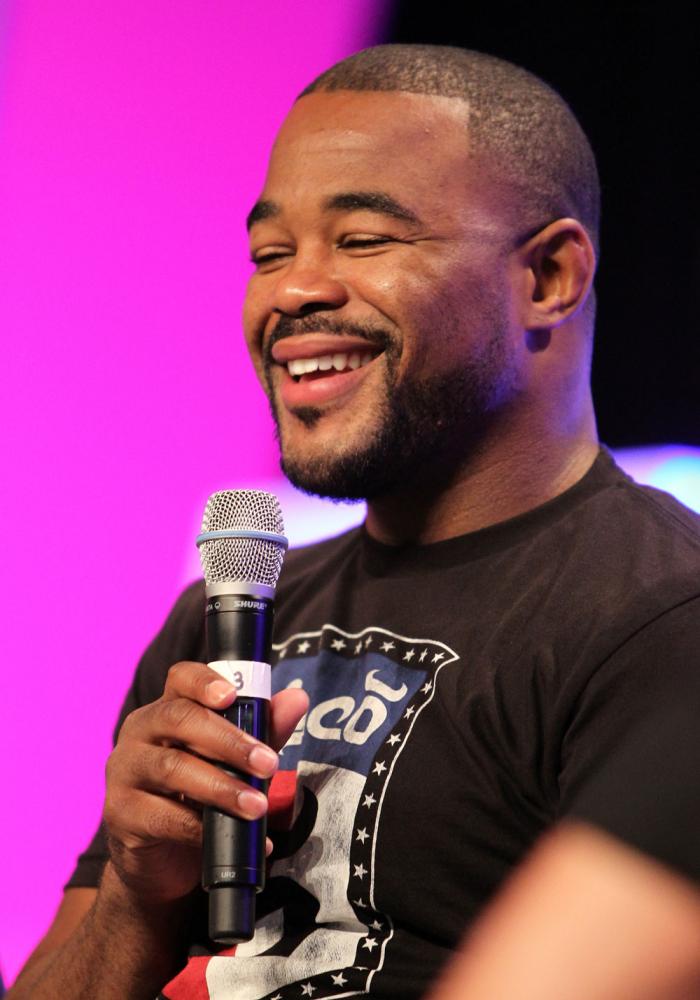 UFC fighter Rashad Evans attends a Q&A session with former cast members of The Ultimate Fighter on the main stage at the UFC Fan Expo