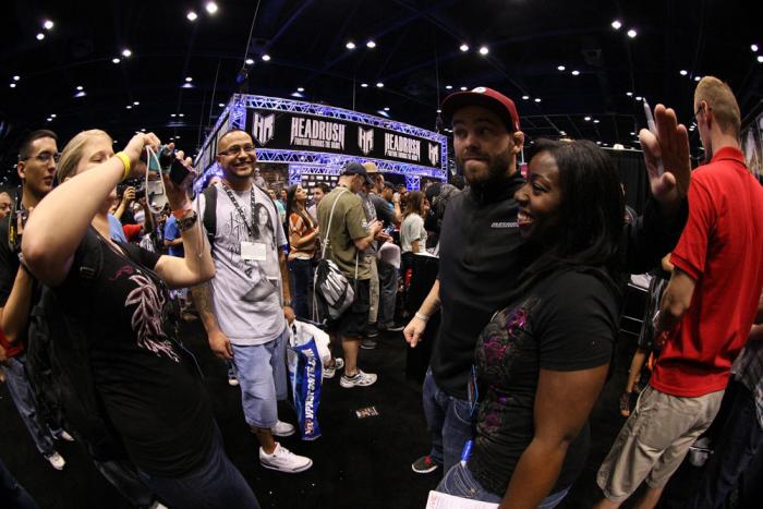 Former UFC Champion Jens Pulver poses for photos with fans at the UFC Fan Expo